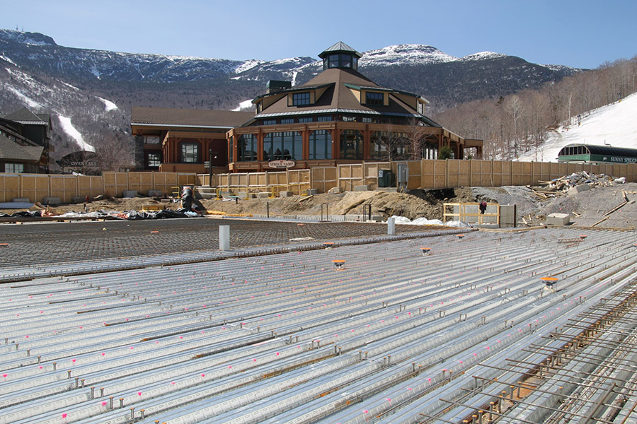 A large, flat rebar reinforced pad sits awaiting concrete.